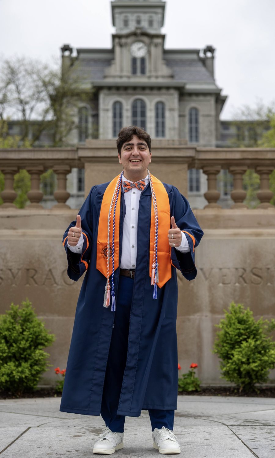 Aaron in his cap and gown at Syracuse University